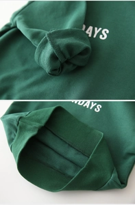 Detail view of cotton terry cloth texture on sleeves and ribbed hem of kids hoodie
