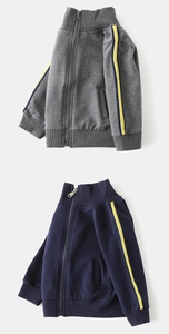 Detail of boys zipper sweatshirts in dark grey and navy with yellow side stripes