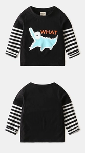 Detail of kids black long-sleeve tee with striped arms and blue crocodile print