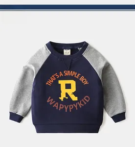 Detail of kids raglan sleeve sweatshirt with letter prints and ribbed crew neck design