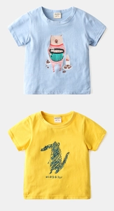Detail of cotton kids t-shirts featuring bear and crocodile prints in blue and yellow