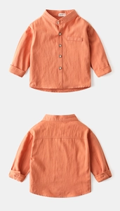 Detailed flat lay of orange cotton linen kids shirt showing front and back textures