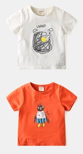 Detail of two kids cotton t-shirts in white and orange with cute cartoon animal prints