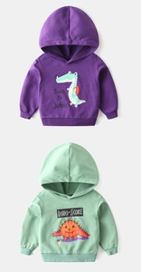Close-up of kids cartoon hoodies with ribbed cuffs and back to school crocodile print