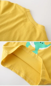 Detailed view of high-density double stitching on yellow cotton cartoon dinosaur shirt