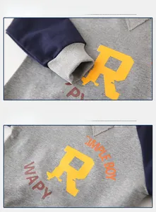 Detail of kids sweatshirt showing color-block sleeves and letter R printed on chest