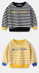 Close-up of children's striped sweatshirts with Next Level embroidery and ribbed cuffs
