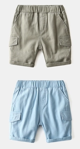 Detail of boys cargo shorts with elastic waist and side flap pockets in green and blue