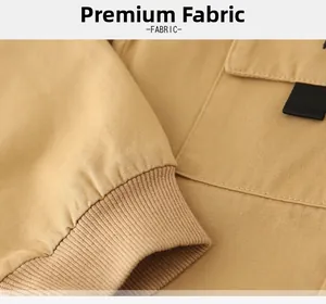 Detail of khaki cotton jacket showing ribbed cuffs, flat pockets and fine stitching