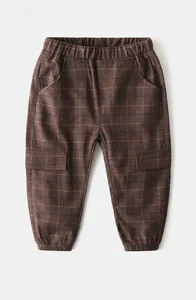 Detailed view of kids plaid casual trousers featuring elastic waist and cargo side pockets