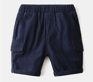 Detail of dark blue boys cargo shorts with elastic waist and utility side pockets