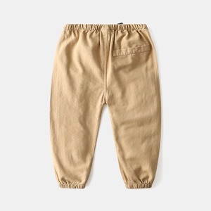 Kids casual khaki jogger pants with elastic waist and ribbed cuffs on grey background