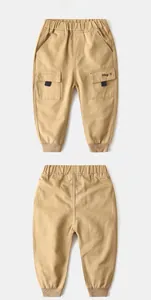 Front and back detail of khaki kids cargo pants with elastic waist and Hey embroidery
