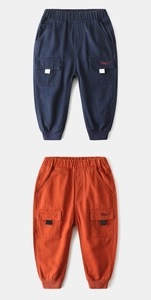 Detail of elastic waist and embroidered side pockets on cargo pants for children