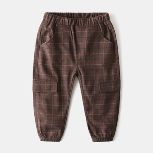 Detail of kids brown plaid trousers with elastic waist and cargo style utility pockets