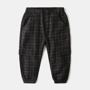 Detail of kids' plaid jogger pants with elastic waist and cargo side pocket