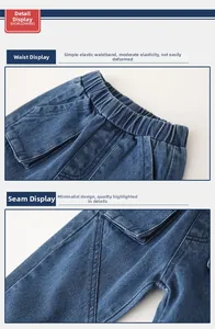 Detail view of elastic waistband and stitching on blue denim pants for kids