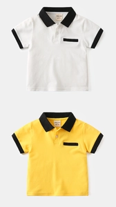 Detail of white and yellow cotton polo shirts with black collars and small pockets