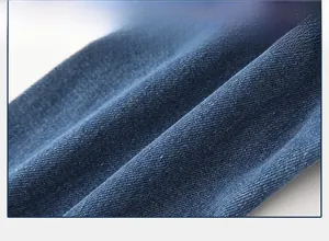 Close-up of premium blue denim fabric with soft cotton texture for kids' casual pants
