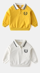Detail of embroidered laurel wreaths and striped polo collars on boys' cotton sweatshirts