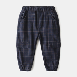 Detail view of navy blue plaid toddler trousers with elastic waist and cargo pockets