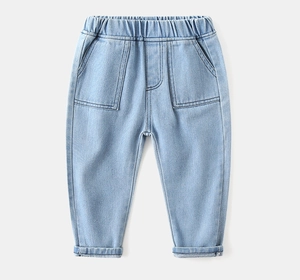 Close-up of boys' light blue denim trousers with elastic waist and large pockets