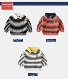Detail of baby boys striped long sleeve polo shirts with cute cartoon tiger patches