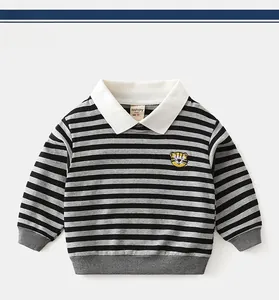 Detailed view of striped boys' sweatshirt featuring a yellow tiger head embroidery and white collar