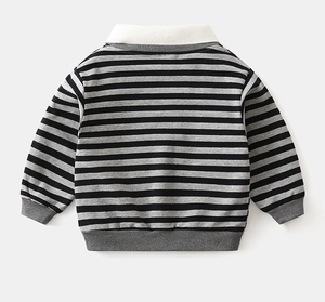 Close-up of baby boy striped sweatshirt featuring white collar and ribbed cuffs