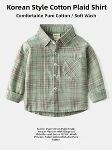 Detail of 100% cotton green plaid boys long sleeve shirt with soft washed texture