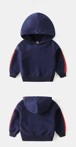 Detail view of navy blue kids hoodie with red side stripes and boys embroidery