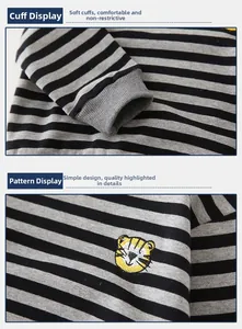 Detail of ribbed cuffs and tiger embroidery on boys' striped knitted sweatshirt