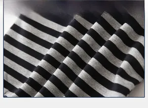 Macro shot of soft black and grey striped knit fabric with breathable flat texture