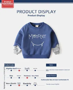 Detail of blue monster sweatshirt for boys featuring thick fleece lining and ribbed cuffs