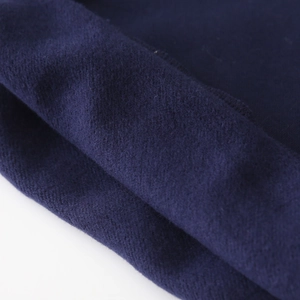 Close-up of thick navy blue fleece lining for boys' hooded sweatshirts with durable stitching