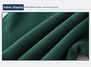 Detailed view of soft dark green knitted cotton fabric for toddler hoodies