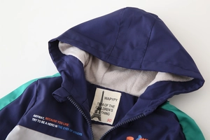 Close-up of windproof fleece lining and zipper details on children hood jacket