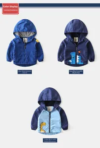 Detailed view of three hooded boys' jackets with colorful cartoon embroidery appliques