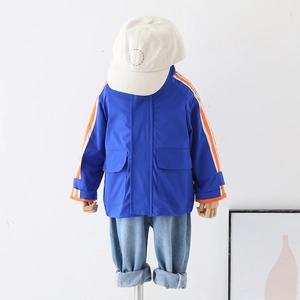 Blue boys zipper jacket with orange striped sleeves on mannequin for kids casual wear