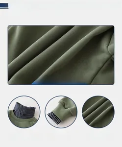 Detail von dunkelgrünem Kinderpullover mit gestreiftem Kragen, Rippbündchen und Baumwollstoff