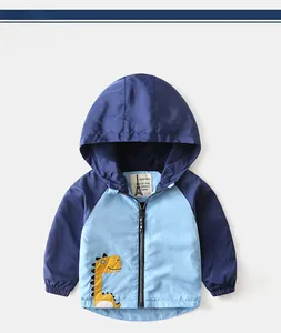 Detail of color-block hooded windbreaker for boys with dinosaur patch and zipper texture