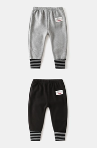 Close-up of elastic waist and striped ribbed cuffs on thick children's warm trousers