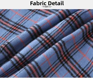 Close-up of blue plaid cotton fabric with soft texture and classic check pattern