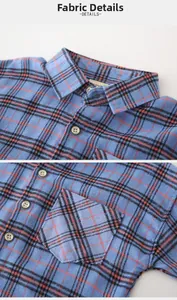 Detail of blue plaid cotton fabric with buttoned collar and chest pocket for boys shirt