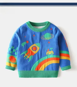 Detail of round neck and space rocket embroidery on blue knitted kids sweater