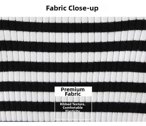 Close-up of black and white striped ribbed knit fabric showing high elasticity and texture