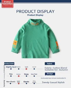 Detail view of boys high-neck green sweatshirt with orange collar embroidery and cotton fabric