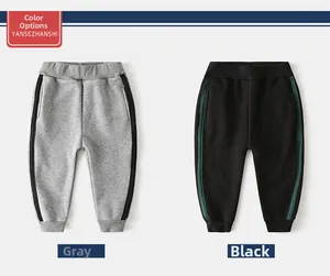 Detail view of boys fleece sports pants in grey and black with elastic waistband
