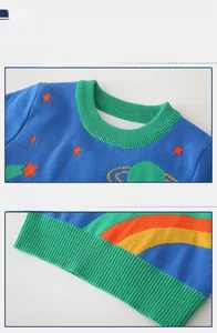 Detail view of the ribbed knit neckline and star pattern on this blue boys' sweater