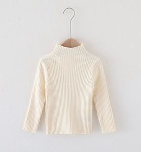 Detail of a kids cream high-neck ribbed knit sweater on a wooden hanger with soft texture